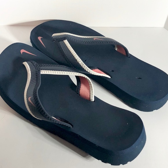 navy blue nike flip flops